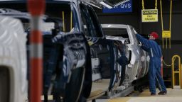 A worker inspects pickup trucks at the General Motors Co. assembly plant in Flint, Michigan, U.S., on Tuesday, Feb. 5, 2019. GM is selling lots of expensive pickup trucks and sport utility vehicles in the U.S., which helped its average vehicle sales price hit a record $36,000. That played a big role in the better-than-expected quarterly earnings. Photographer: Jeff Kowalsky/Bloomberg via Getty Images 