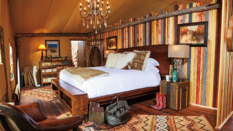 The luxury tents at The Resort at Paws Up in Montana include a full-service butler, heated floors, en suite bathroom.