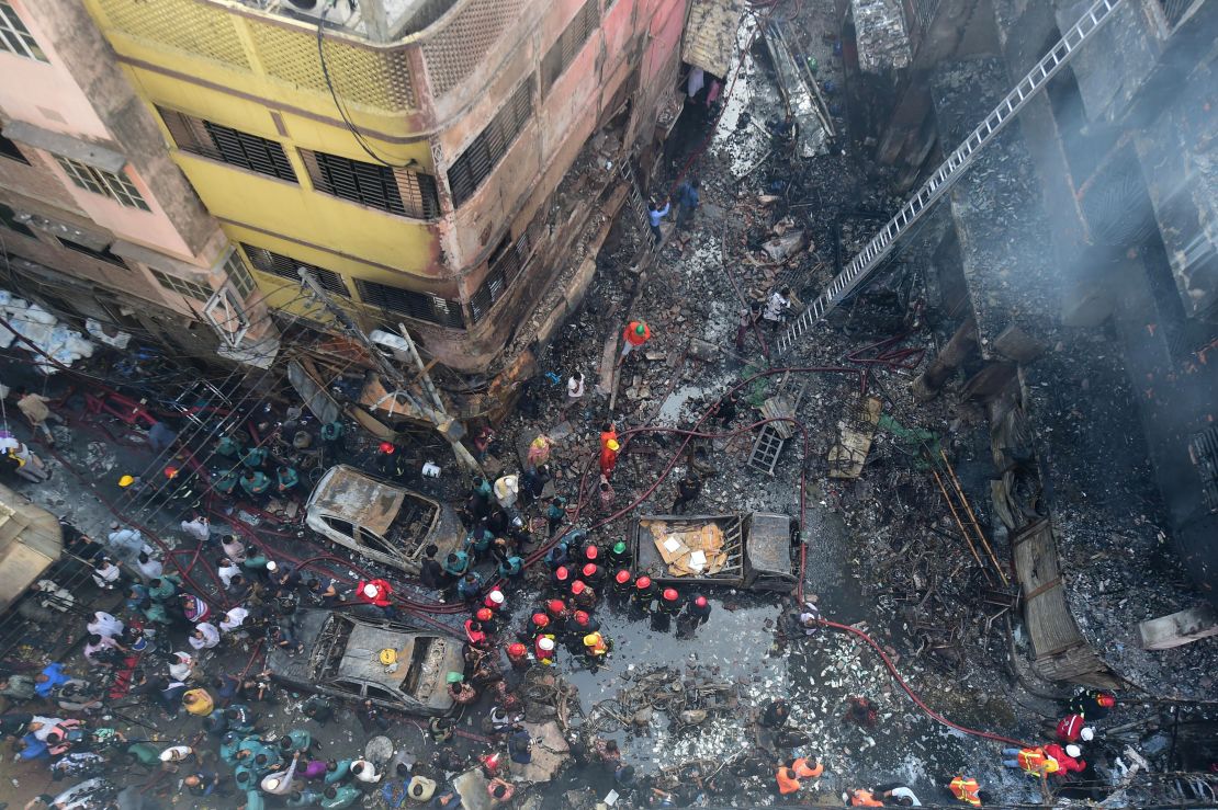 Firefighters are seen at the scene of a fire in Dhaka on February 21, 2019. 