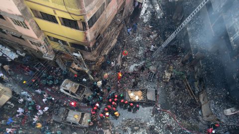 Firefighters are seen at the scene of a fire in Dhaka on February 21, 2019.