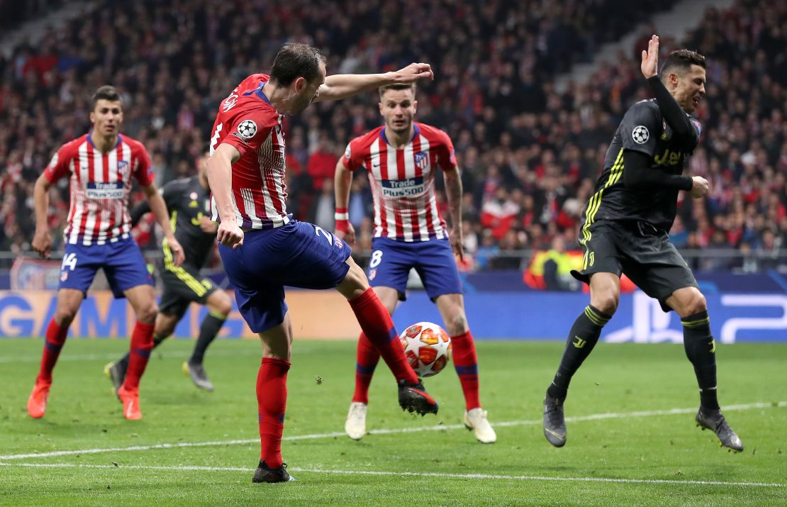 Diego Godin fires home his side's second with the aid of a deflection off Cristiano Ronaldo.