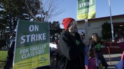 Garrick Ruiz, union member with United Teachers of Los Angeles, center, yells while teachers and supporters march outside of Manzanita Community School in Oakland, Calif., Thursday, Feb. 21, 2019. Teachers in Oakland went on strike Thursday in the country's latest walkout by educators over classroom conditions and pay. (AP Photo/Jeff Chiu)