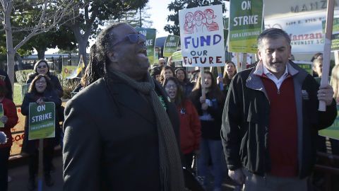 Oakland Education Association President Keith Brown yells with teachers as they strike for higher pay. 