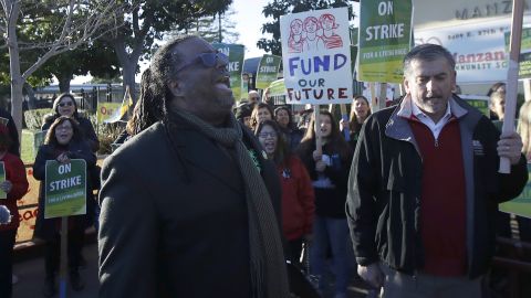 Teachers' union president Keith Brown yells after speaking outside of a school in Oakland on February 21.
