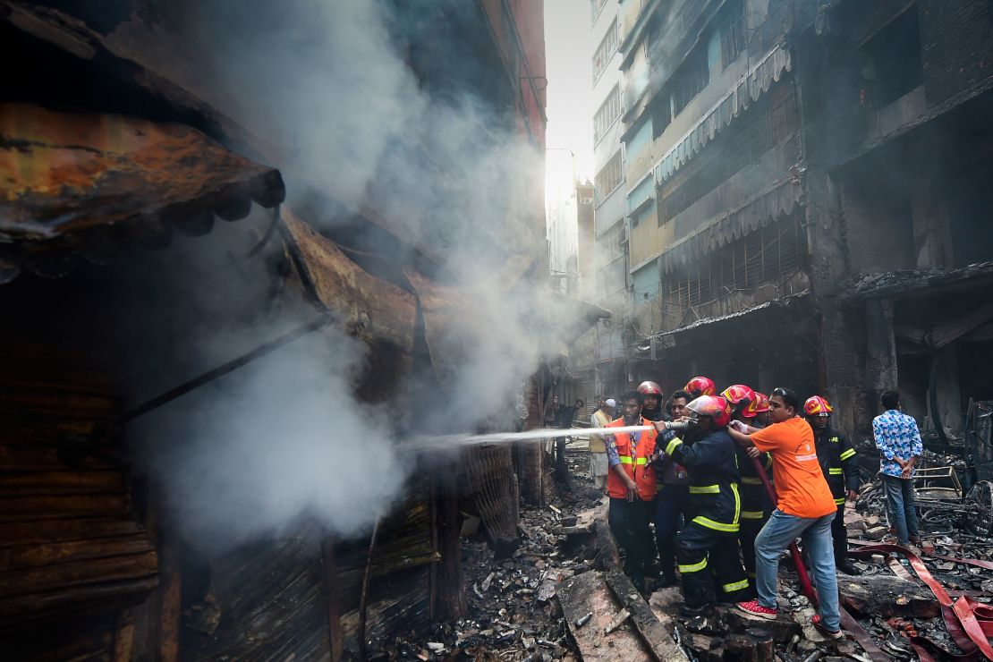 Firefighters try to extinguish a fire in Dhaka on February 21, 2019. 