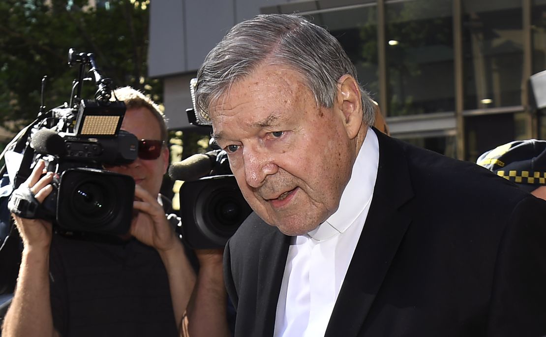 Cardinal George Pell walks to a car in Melbourne on December 11.