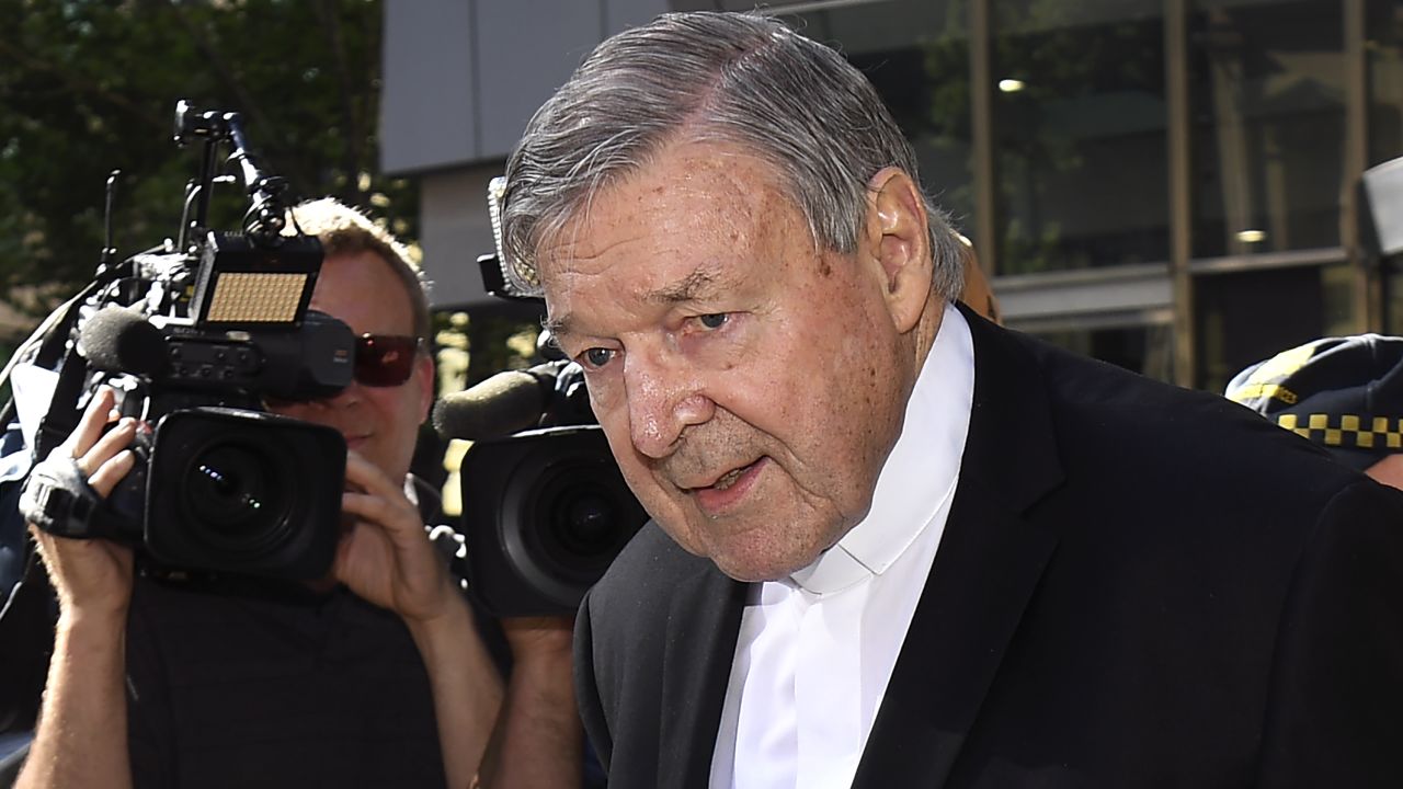 Cardinal George Pell walks to a car in Melbourne on December 11.