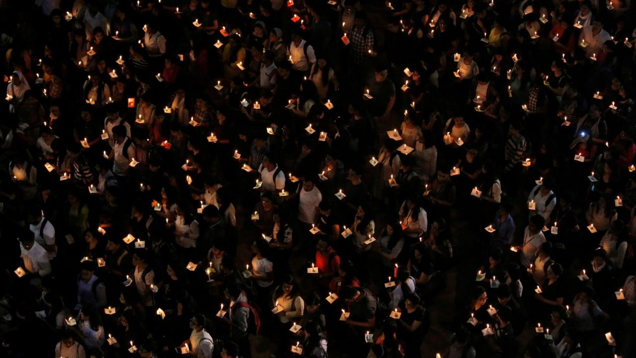 College students in Kolkata, India, hold candles Tuesday, February 19, during a vigil for paramilitary personnel <a href="https://www.cnn.com/2019/02/14/asia/kashmir-attack-india-bus-attack-intl/index.html" target="_blank">who were killed when a bomb exploded near their convoy</a> in Indian-administered Kashmir.