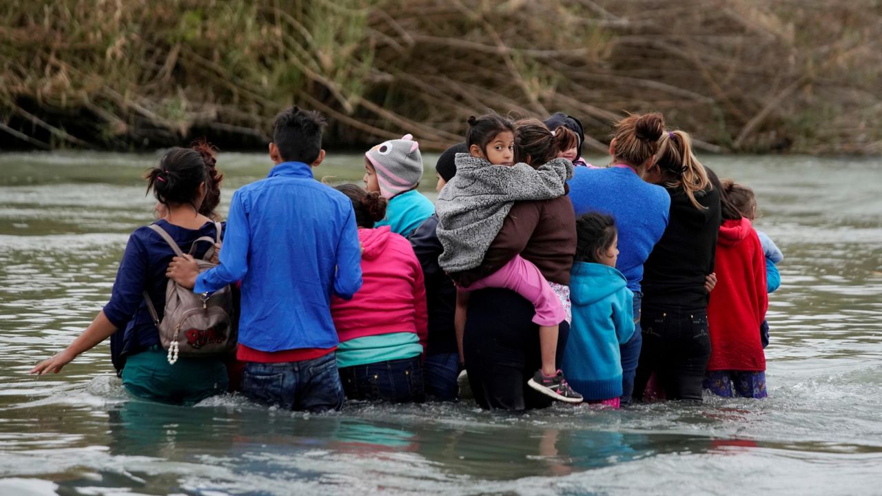 Migrants in Piedras Negras, Mexico, cross the Rio Bravo on their way to the United States on Tuesday, February 19. It was four days after US President Donald Trump <a href="https://www.cnn.com/politics/live-news/government-shutdown-february-2019/index.html" target="_blank">declared a national emergency</a> on the southern border.
