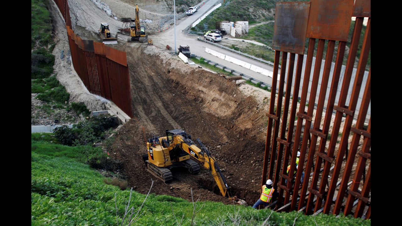 Construction crews begin to replace some of the aging fencing on the border that separates San Diego from Tijuana, Mexico, on Monday, February 18. The replacement project had been in the works for some time and is not related to the recent controversy over new wall funding.
