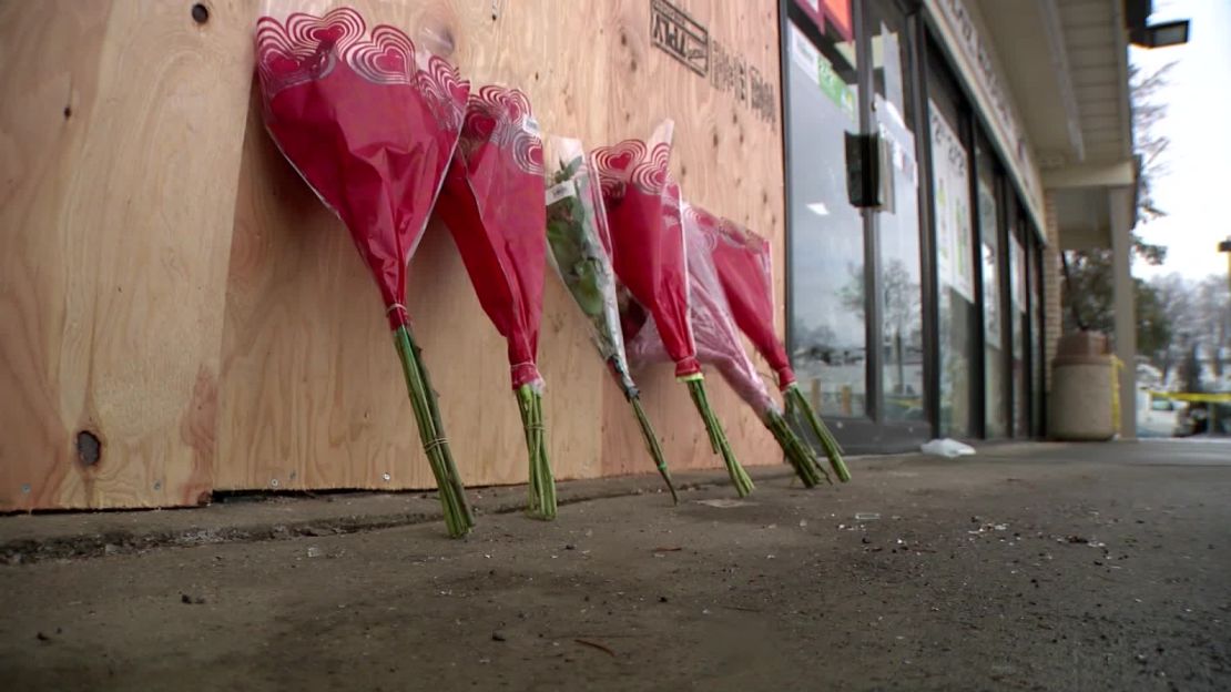 Flowers were laid outside the 7-Eleven where the incident occurred.