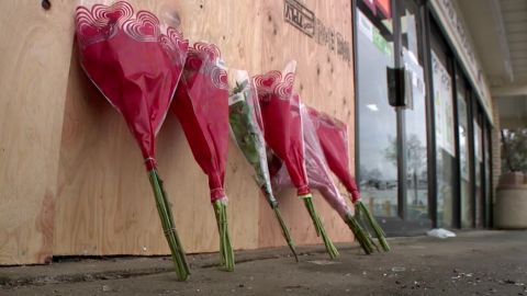 Flowers were laid outside the 7-Eleven where the incident occurred.