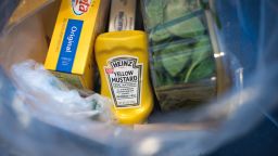 A bottle of Heinz Kraft Co. Heinz brand Yellow Mustard sits in a grocery bag in an arranged photograph taken in Dobbs Ferry, New York, U.S., on Wednesday, Feb. 20, 2019. Kraft Heinz Co. is releasing earnings figures on February 21. Photographer: Tiffany Hagler-Geard/Bloomberg via Getty Images