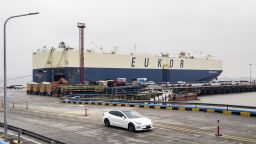 Tesla Model 3's roll off a ship at Shanghai's port. (Click to expand.)