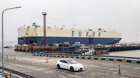 Tesla Model 3's roll off a ship at Shanghai's port. (Click to expand.)
