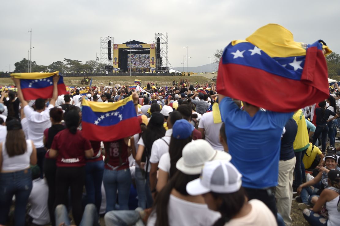 People await the start of Friday's concert organized by Richard Branson in Cucuta, Colombia.