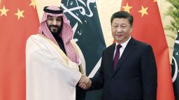In this photo released by Xinhua News Agency, Saudi Crown Prince Mohammad bin Salman, left, shakes hands with Chinese President Xi Jinping before proceeding to their meeting at the Great Hall of the People in Beijing, Friday, Feb. 22, 2019. Saudi Crown Prince Mohammed bin Salman hailed relations with China as trouble-free, during talks Friday with President Xi Jinping in Beijing aimed at strengthening relations in the face of criticism from the West over the kingdom's human rights record and its war in Yemen. (Liu Weibing/Xinhua via AP)