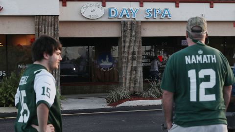 Football fans arrive to the Orchids of Asia Day Spa in Jupiter, Florida on Friday.