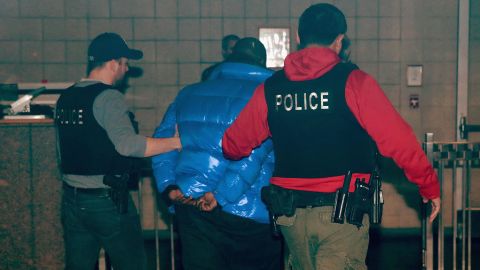 R&B singer R. Kelly is taken into custody after turning himself in to police in Chicago.