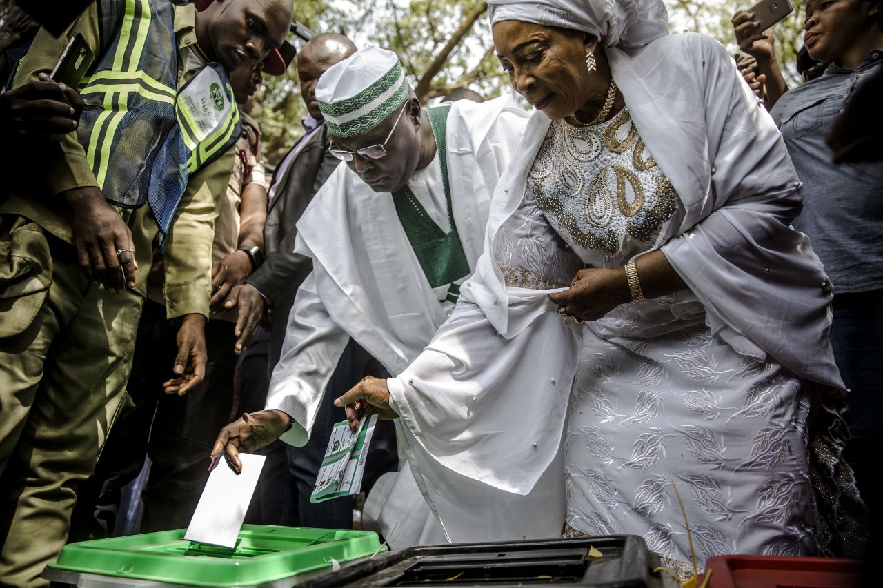 Presidential candidate and main opposition leader Atiku Abubakar casts his vote along with his wife, Amina Titilayo Atiku-Abubakar, at Agiya polling station in Yola.