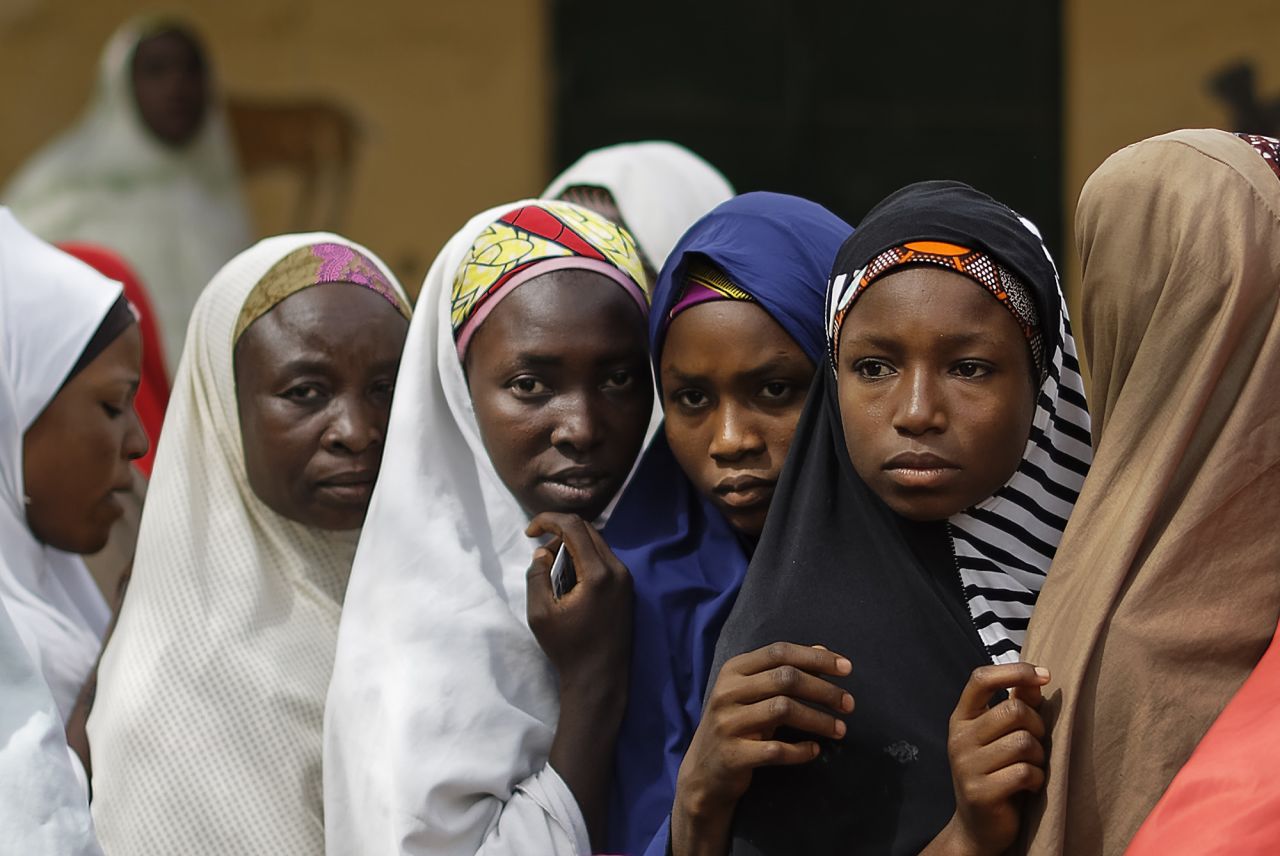 Women line up to cast their votes in the village of Tumfafi, near Kano.