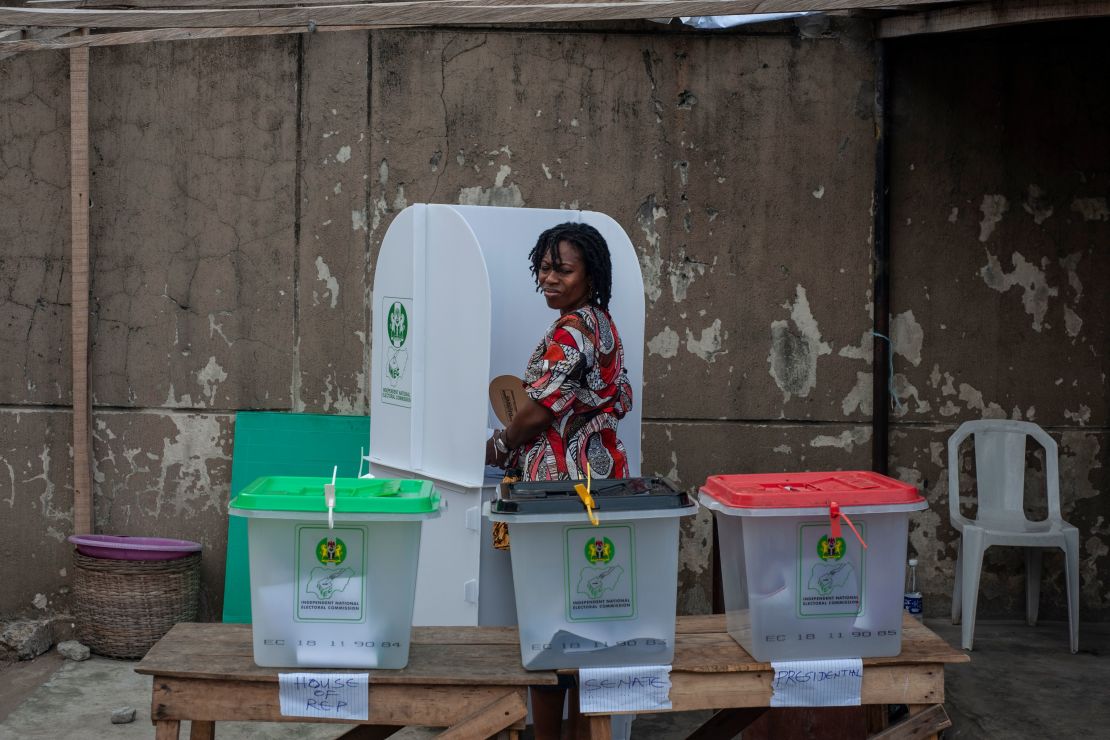 A woman glances over at the ballot boxes one last time before casting her vote Saturday in Lagos.