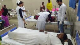 Indian victims are under medical treatment at Jorhat hospital after allegedly drinking toxic bootleg liquor in Assam's Golaghat district on February 22, 2019. - Twenty-five members of a tribe of Indian tea pickers, including 15 women, died painful deaths within hours of drinking poisoned alcohol, police said on February 22. The deaths in the northeastern state of Assam came less than two weeks after about 100 people died after drinking tainted licquor in Uttar Pradesh and Uttarakhand states. (Photo by Biju BORO / AFP)        (Photo credit should read BIJU BORO/AFP/Getty Images)