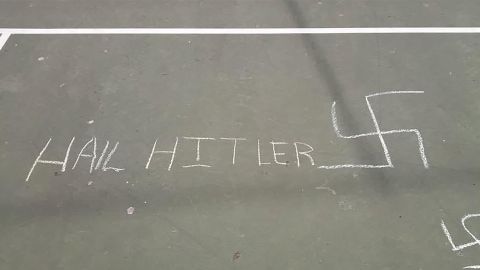 Anti-Semitic symbols and words were found drawn in chalk on an elementary schoolyard in New York City. CREDIT: Council member Chaim Deutsch