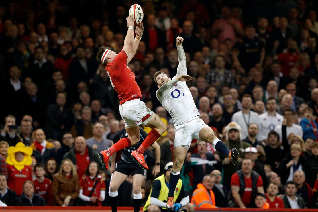 Josh Adams got the better of this aerial duel against Elliot Daly to score Wales' second try against England in the Six Nations. 