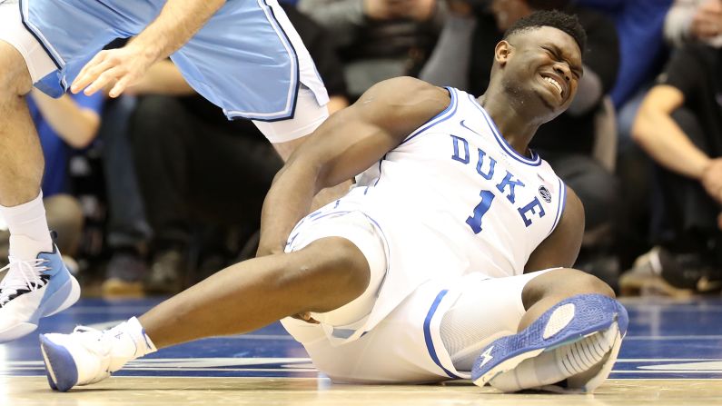 Duke phenom Zion Williamson holds the back of his right leg, which he injured after <a href="index.php?page=&url=https%3A%2F%2Fwww.cnn.com%2F2019%2F02%2F21%2Fsport%2Fzion-williamson-basketball-college-sports-nike-shoe-spt-intl%2Findex.html" target="_blank">his left shoe exploded</a> just 33 seconds into a much-anticipated game against North Carolina on Wednesday, February 20. Williamson, who is thought by many to be basketball's brightest prospect since LeBron James, missed the rest of the game and is day-to-day with a knee sprain.