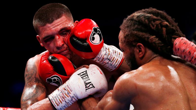 Lee Selby absorbs a blow from Omar Douglas during their lightweight bout in London on Saturday, February 23. Selby won by unanimous decision.