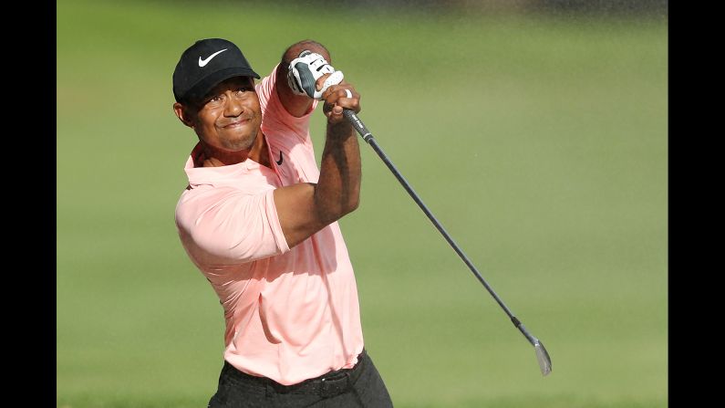 Tiger Woods follows through on <a href="index.php?page=&url=https%3A%2F%2Fwww.golfchannel.com%2Fnews%2Ftiger-woods-makes-par-9-spectacular-shot-fairway-bunker" target="_blank" target="_blank">a spectacular bunker shot</a> while playing a tournament in Mexico City on Friday, February 22.
