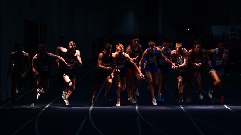 College sprinters take off from the starting line during a 4x400-meter relay race in Seattle on Friday, February 22.