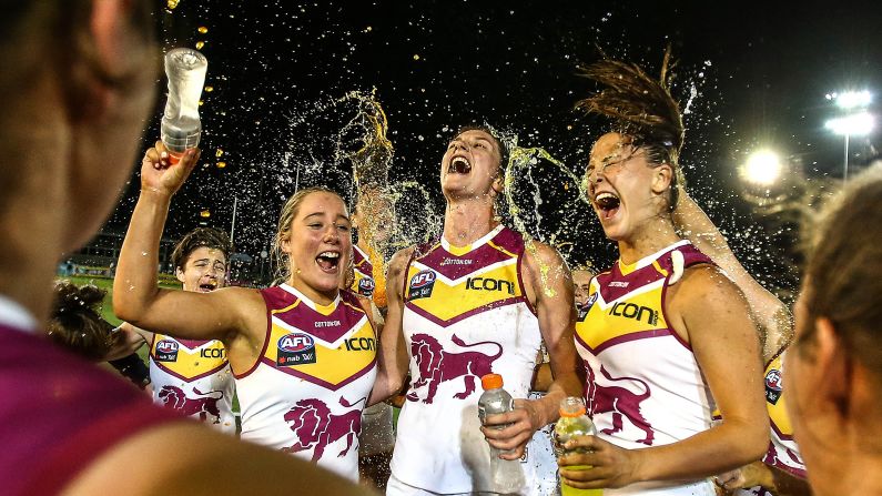 Members of the Brisbane Lions, an Australian Football League team, celebrate a victory over the Western Bulldogs on Saturday, February 23.