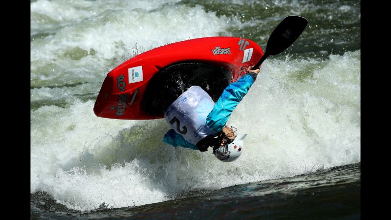 Japanese canoeist Yoshiko Suematsu flips over during a competition in Penrith, Australia, on Sunday, February 17.