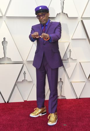 Spike Lee, nominated in the best director category for "BlacKkKlansman," paired his purple Ozwald Boateng suit with gold Jordans, a necklace bearing Prince's symbol and rings reading "Love" and "Hate," a tribute to his 1989 film, "Do the Right Thing." 
