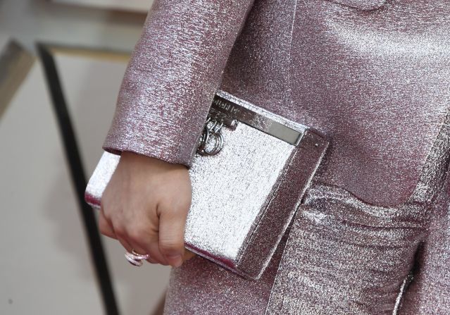 The Crazy Rich Asians star also accessorized with a clutch that doubled as a tequila-filled flask.