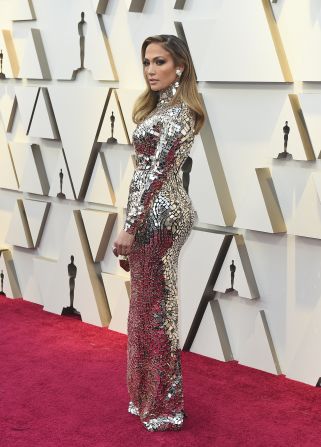 Presenter Jennifer Lopez stunned in a long-sleeved, mirror embroidered Tom Ford gown. Earlier in the night, she tweeted a clip of her walking out onto the Oscars stage in 1999 in Badgley Mischka, reminding us, two decades on, JLo still reigns on the red carpet.<br />