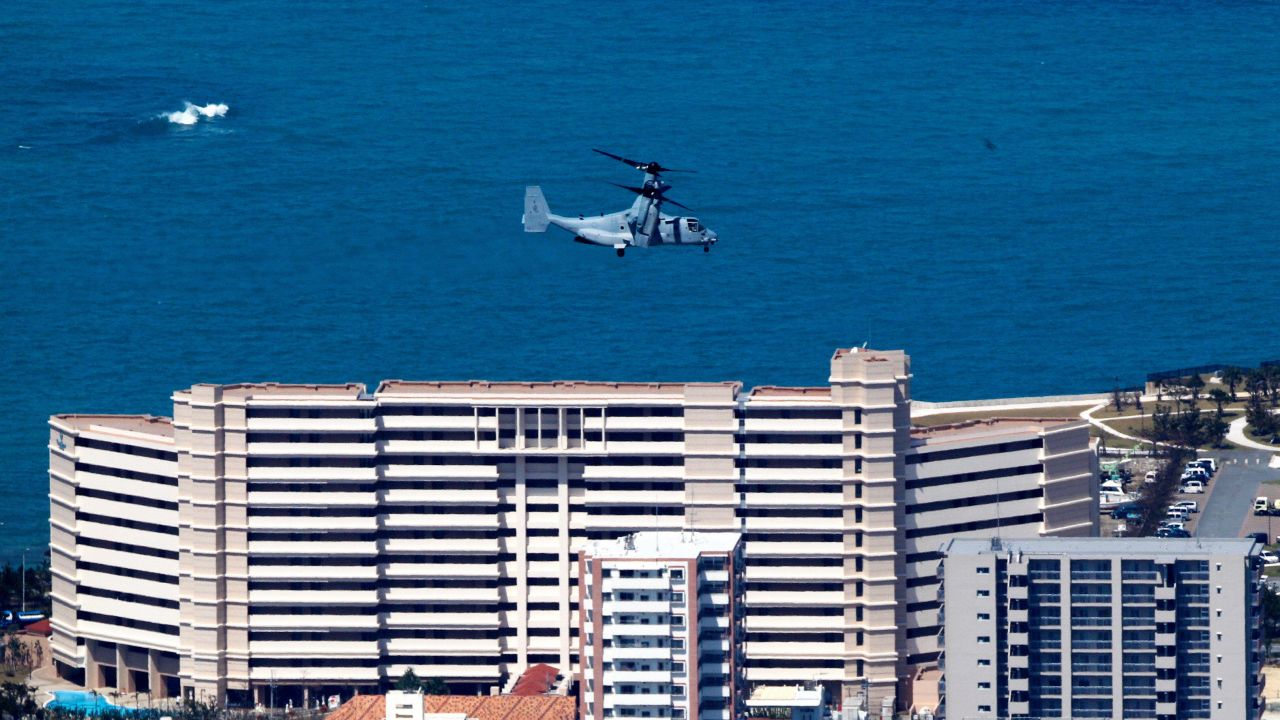 An US aircraft MV-22 Osprey flies over the residential area of Ginowan City to land the US Marine Corps Futenma Air Station on October 1, 2012 in Ginowan, Okinawa, Japan.