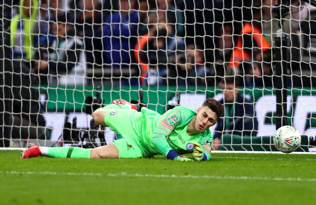 Kepa allows Sergio Aguero's weak penalty to squirm under his hands.