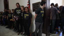 epa07397280 Activists with the Sunrise Movement protest at Senate Majority Leader Mitch McConnell's office in the Russell Senate Office Building on Capitol Hill in Washington, DC, USA, 25 February 2019. Activists from around the country joined Kentucky high schoolers trying to confront Mitch McConnell about his rush to vote on the Green New Deal.  EPA/SHAWN THEW
