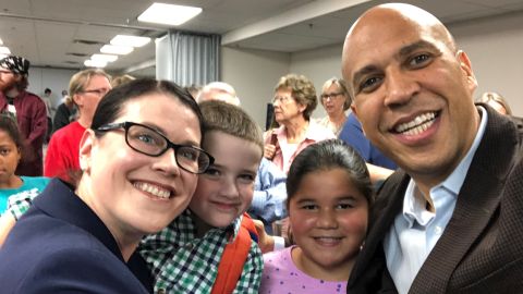 Iowa voter Meghann Foster with 2020 presidential candidate Cory Booker.