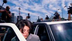 Monica Lewinsky surrounded by photographers as she gets into car. Lewinsky is on her way to the FBI Headquarters. (Photo by Jeffrey Markowitz/Sygma via Getty Images)