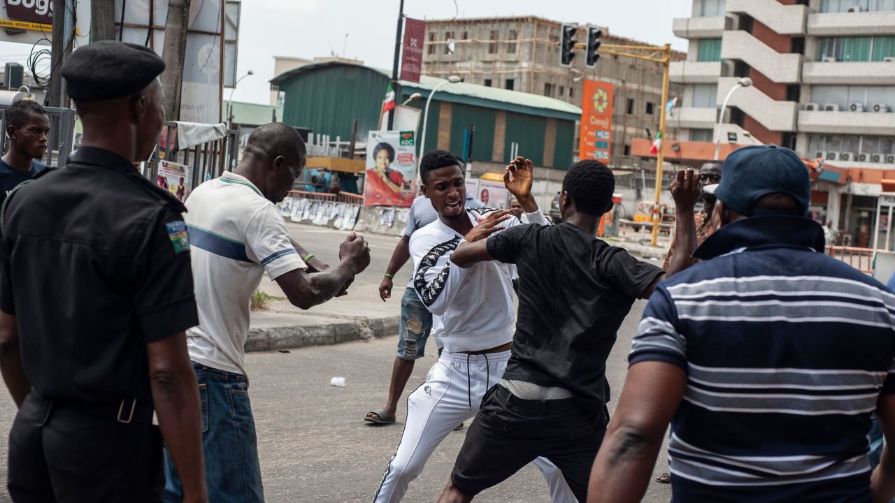 A fight breaks out over the alleged distribution of money for votes at a polling unit in Alagomeji-Yaba in Lagos on February 23, 2019 during the general elections. 