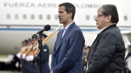 In this photo released by Colombia's presidential press office, Venezuelan opposition leader Juan Guaido, who declared himself interim president of Venezuela, makes a statement as Colombian Foreign Minister Carlos Holmes Trujillo stands by during a welcome ceremony for Guaido at the military airport in Bogota, Colombia, Sunday, Feb. 24, 2019. The 35-year-old lawmaker has won the backing of more than 50 governments around the world, but he's so far been unable to cause a major rift inside the Venezuelan military in a country ravaged by hyperinflation and widespread shortages. (Efrain Herrera/Colombian presidential press office via AP)