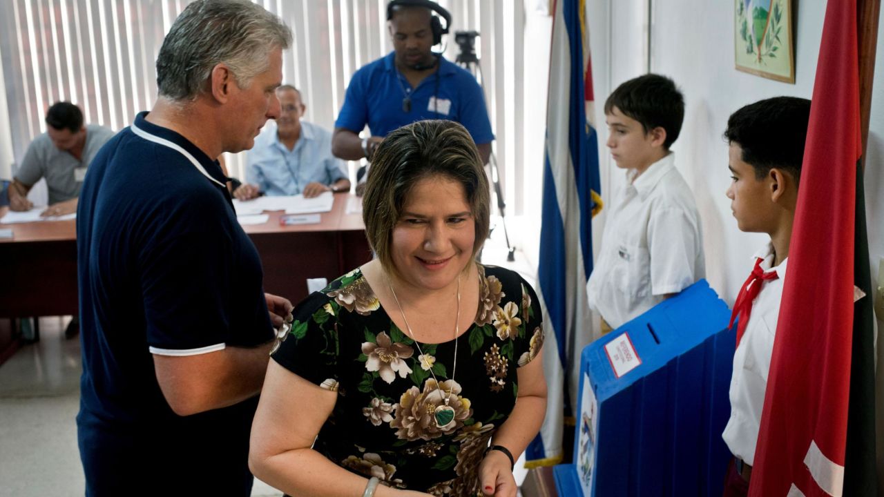 Cuban President Miguel Diaz-Canel and his wife, Lis Cuesta, vote in the referendum for the new Cuban constitution in Havana on February 24.