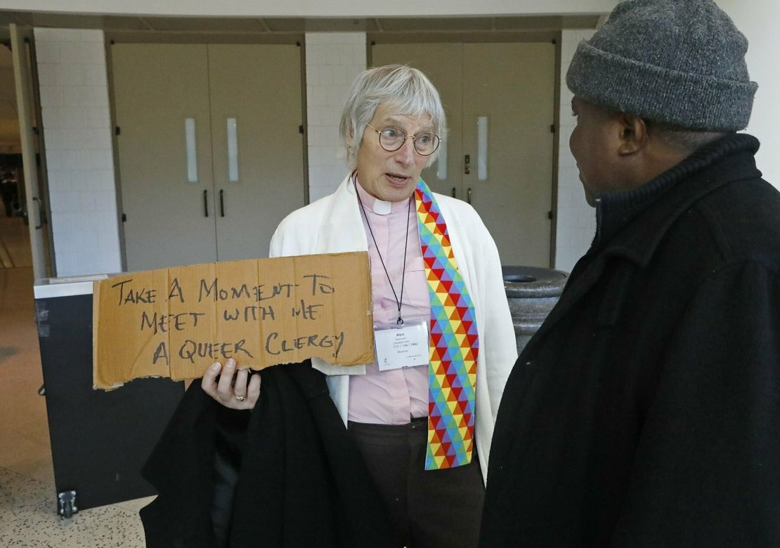 Alyss Swanson, a transgender United Methodist deacon from San Jose, California, speaks with Bishop Samuel Quire of Liberia during the conference Monday.