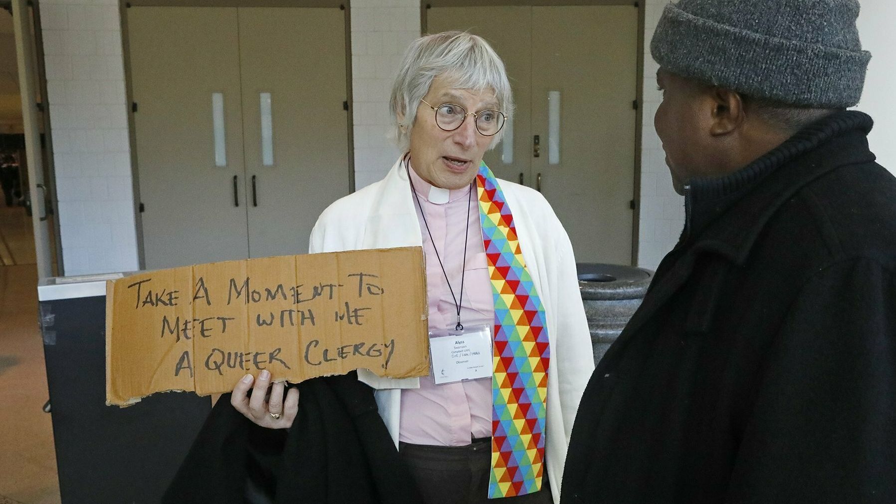 Alyss Swanson, a transgender United Methodist deacon from California, speaks with Bishop Samuel Quire of Liberia during the General Conference of the United Methodist Church in February 2019.