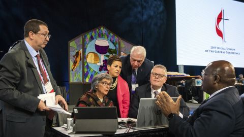 Leaders from the United Methodist Church confer during their conference in St. Louis on Tuesday. 