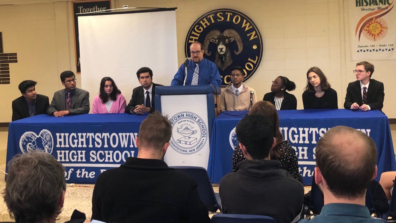 Teacher Stuart Wexler leads a student panel at Hightstown High School to discuss their work on the Cold Case Act.